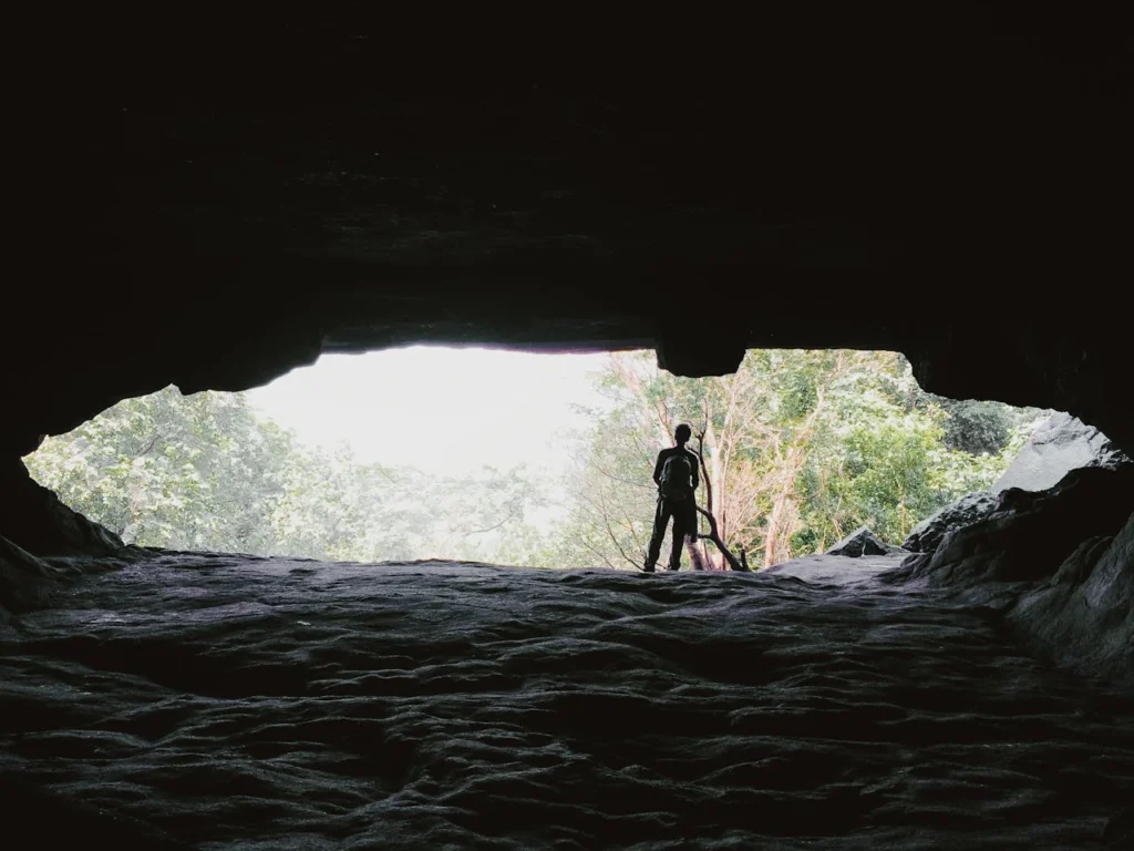 Wide-angle view from inside the Birthing Cave looking out at the Sedona canyon.