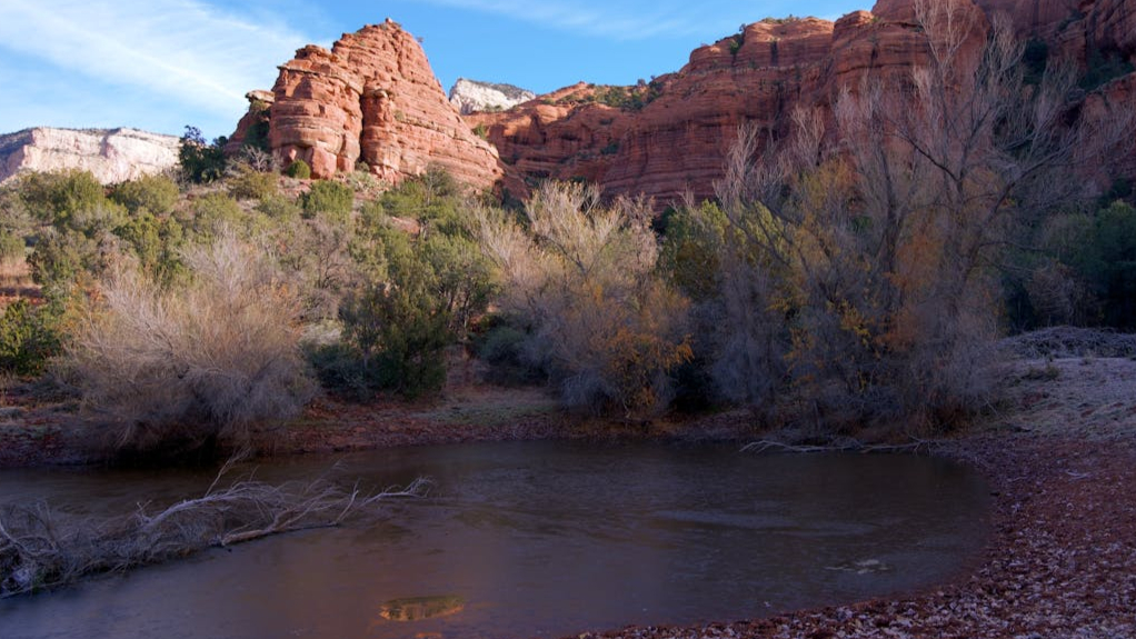 Reflection of Cathedral Rock in a rain puddle on Airport Mesa Trail Sedona.